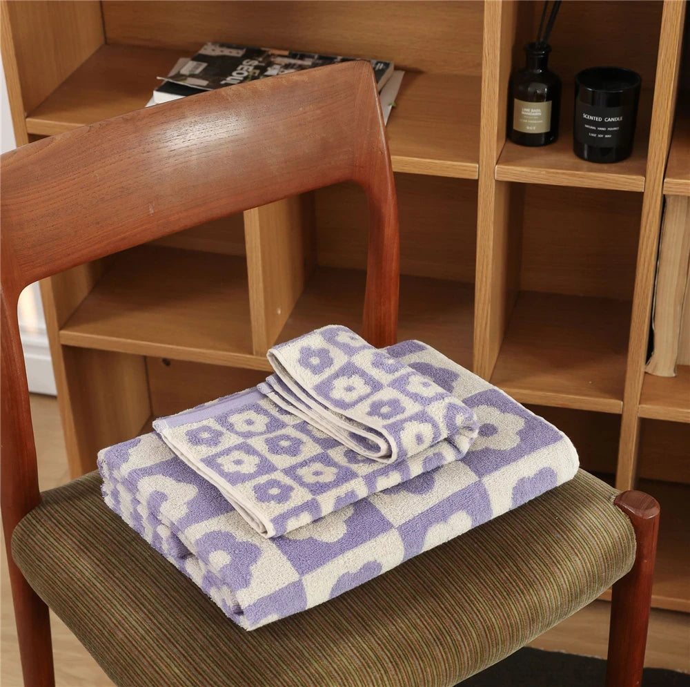 Orion Towel: Retro-inspired hand and bath towels with 70's floral print, soft cotton, various colorways. Shop now.