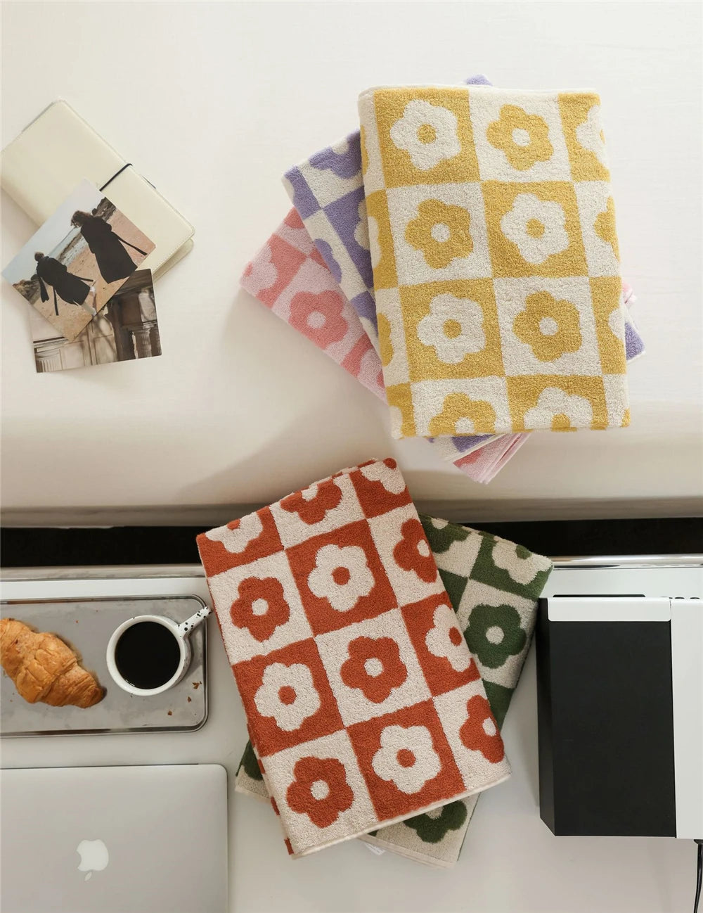 Orion Towel: Retro-inspired hand and bath towels with 70's floral print, soft cotton, various colorways. Shop now.
