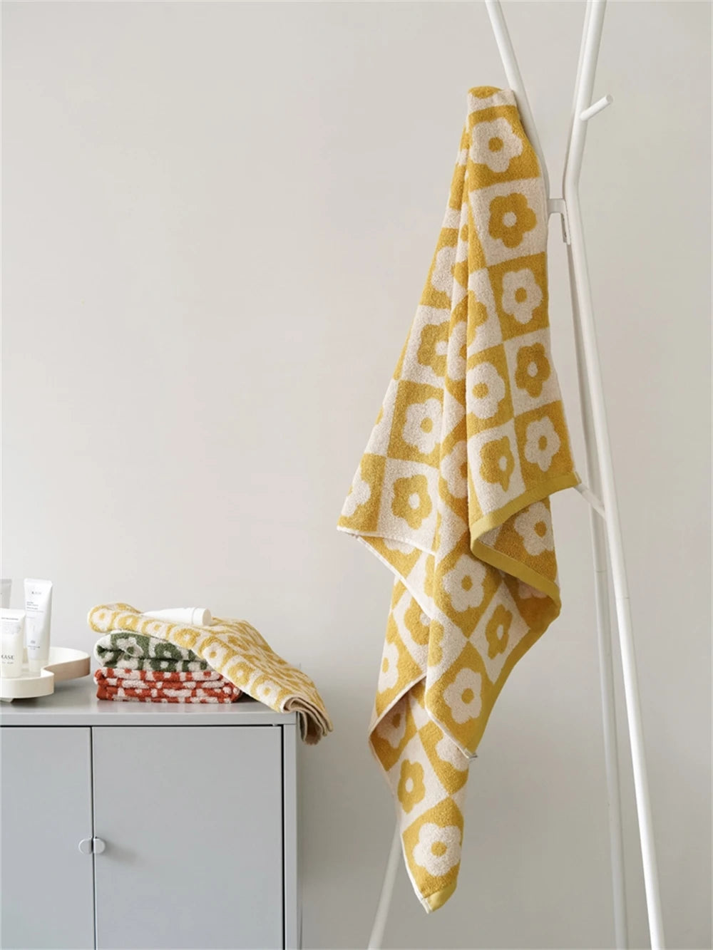 Orion Towel: Retro-inspired hand and bath towels with 70's floral print, soft cotton, various colorways. Shop now.