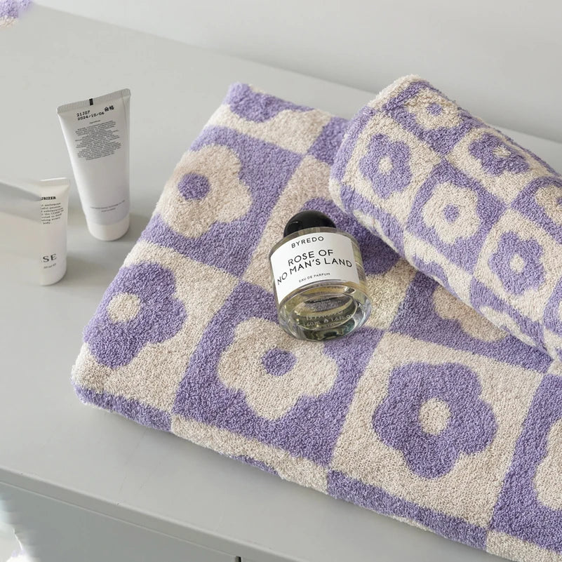 Orion Towel: Retro-inspired hand and bath towels with 70's floral print, soft cotton, various colorways. Shop now.