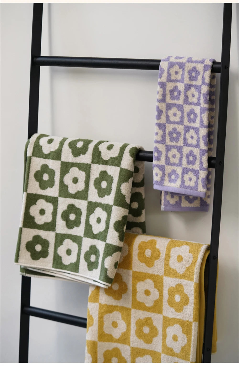 Orion Towel: Retro-inspired hand and bath towels with 70's floral print, soft cotton, various colorways. Shop now.