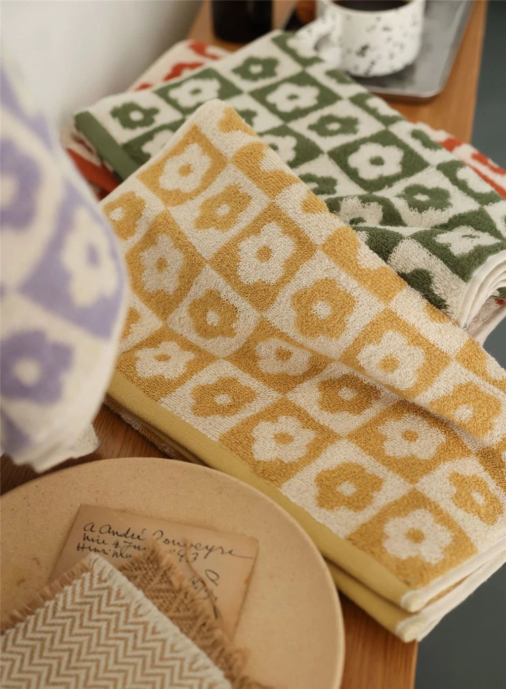 Orion Towel: Retro-inspired hand and bath towels with 70's floral print, soft cotton, various colorways. Shop now.