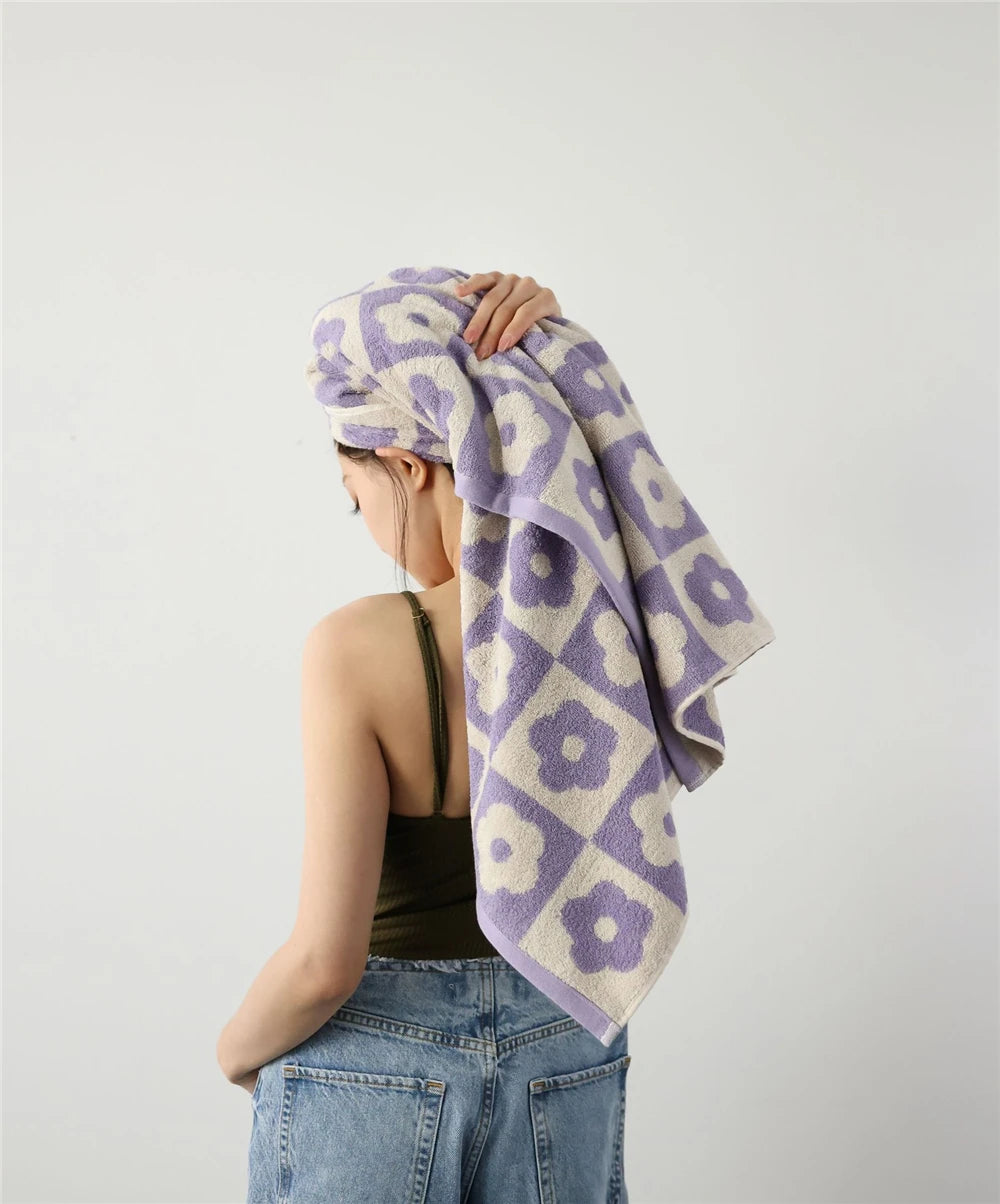 Orion Towel: Retro-inspired hand and bath towels with 70's floral print, soft cotton, various colorways. Shop now.