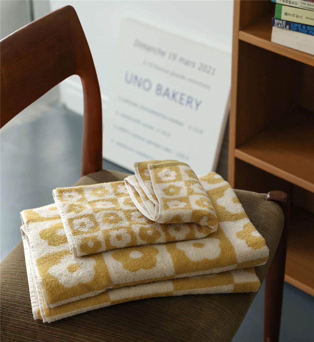 Orion Towel: Retro-inspired hand and bath towels with 70's floral print, soft cotton, various colorways. Shop now.