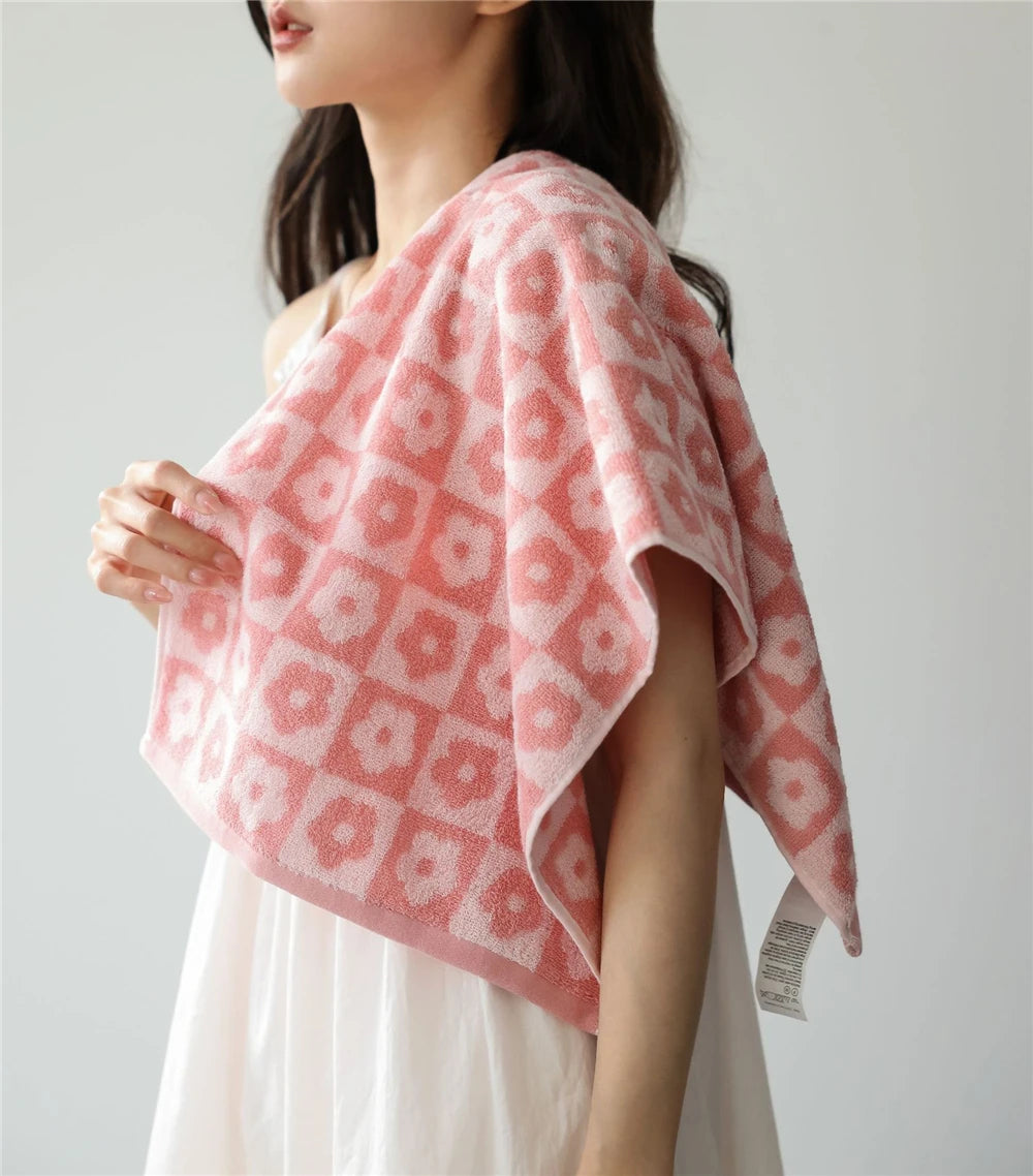 Orion Towel: Retro-inspired hand and bath towels with 70's floral print, soft cotton, various colorways. Shop now.