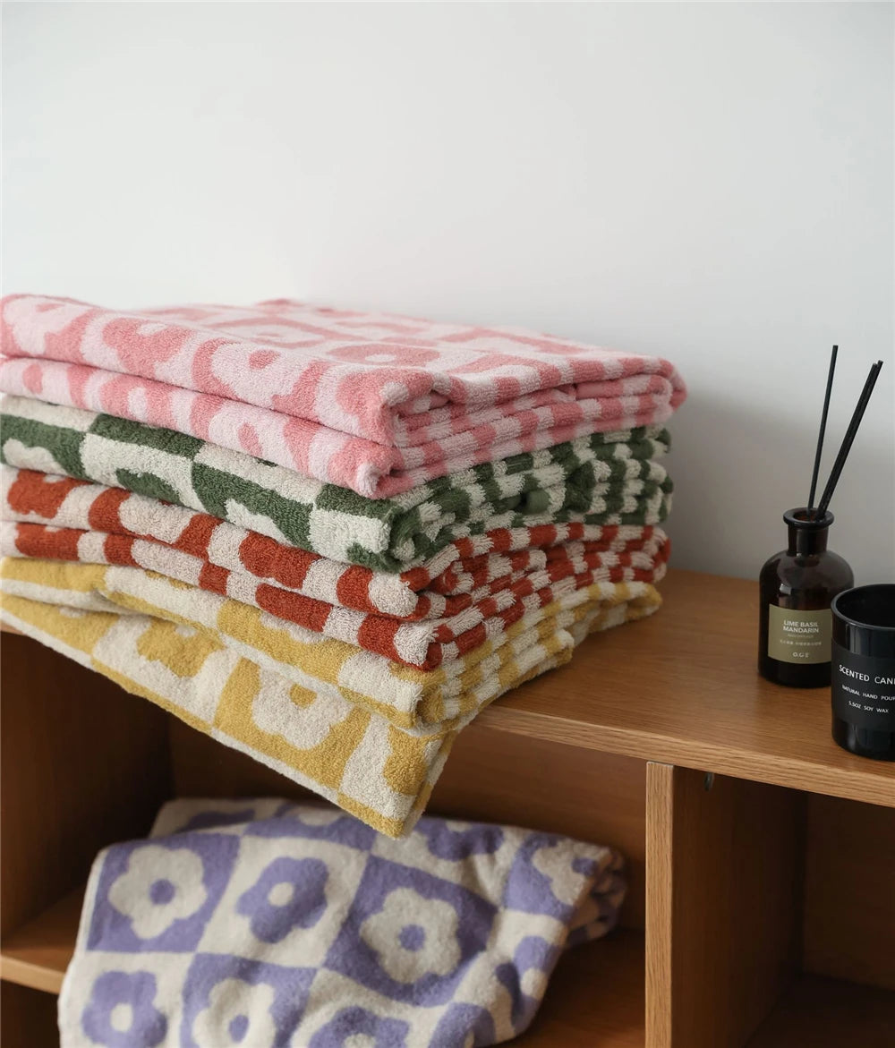 Orion Towel: Retro-inspired hand and bath towels with 70's floral print, soft cotton, various colorways. Shop now.
