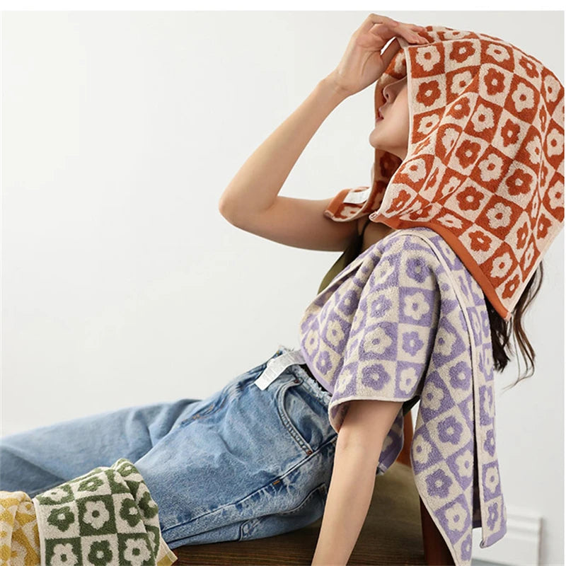 Orion Towel: Retro-inspired hand and bath towels with 70's floral print, soft cotton, various colorways. Shop now.