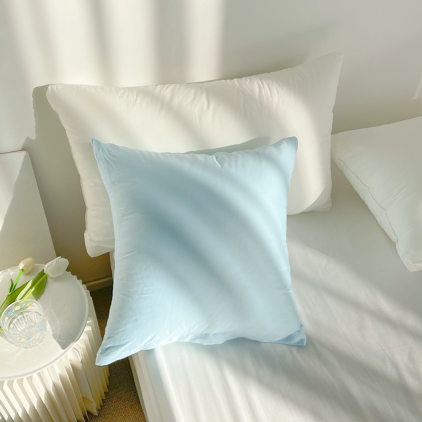 Vibrant cotton throw pillows with ruffle detail, available in solid or lattice prints