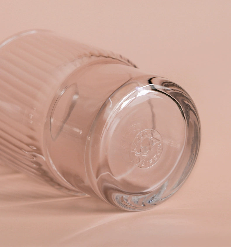 A set of Lyle Stackable Glasses, featuring sleek and minimalistic design. The glasses are crafted from high-quality, clear glass and are stackable for easy storage. Each glass holds 12 ounces, making them ideal for everyday use or entertaining. Perfect for home décor enthusiasts looking to add functional and stylish glassware to their kitchen or dining space.