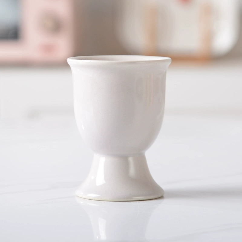 Stylish ceramic egg cup for drippy or hard-boiled eggs - vibrant colors, durable design. Perfect breakfast accessory.