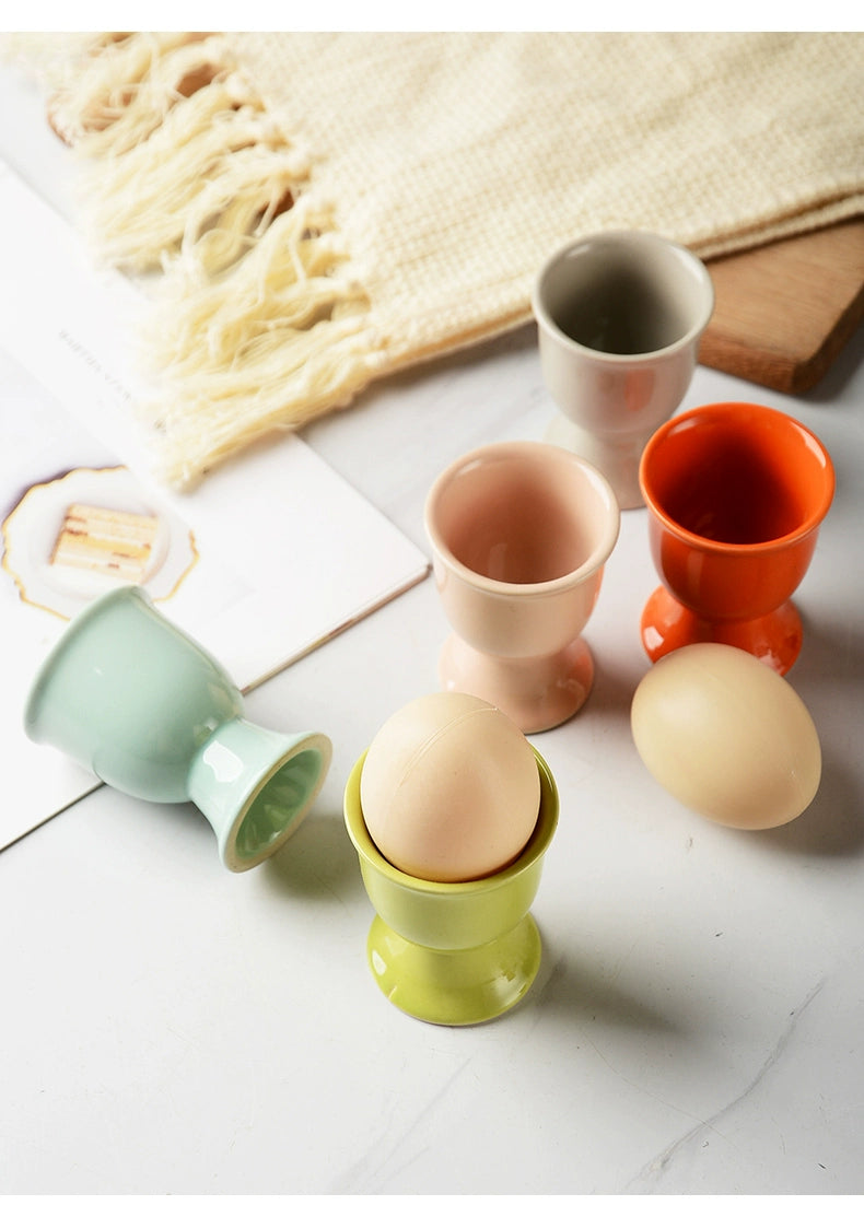 Stylish ceramic egg cup for drippy or hard-boiled eggs - vibrant colors, durable design. Perfect breakfast accessory.
