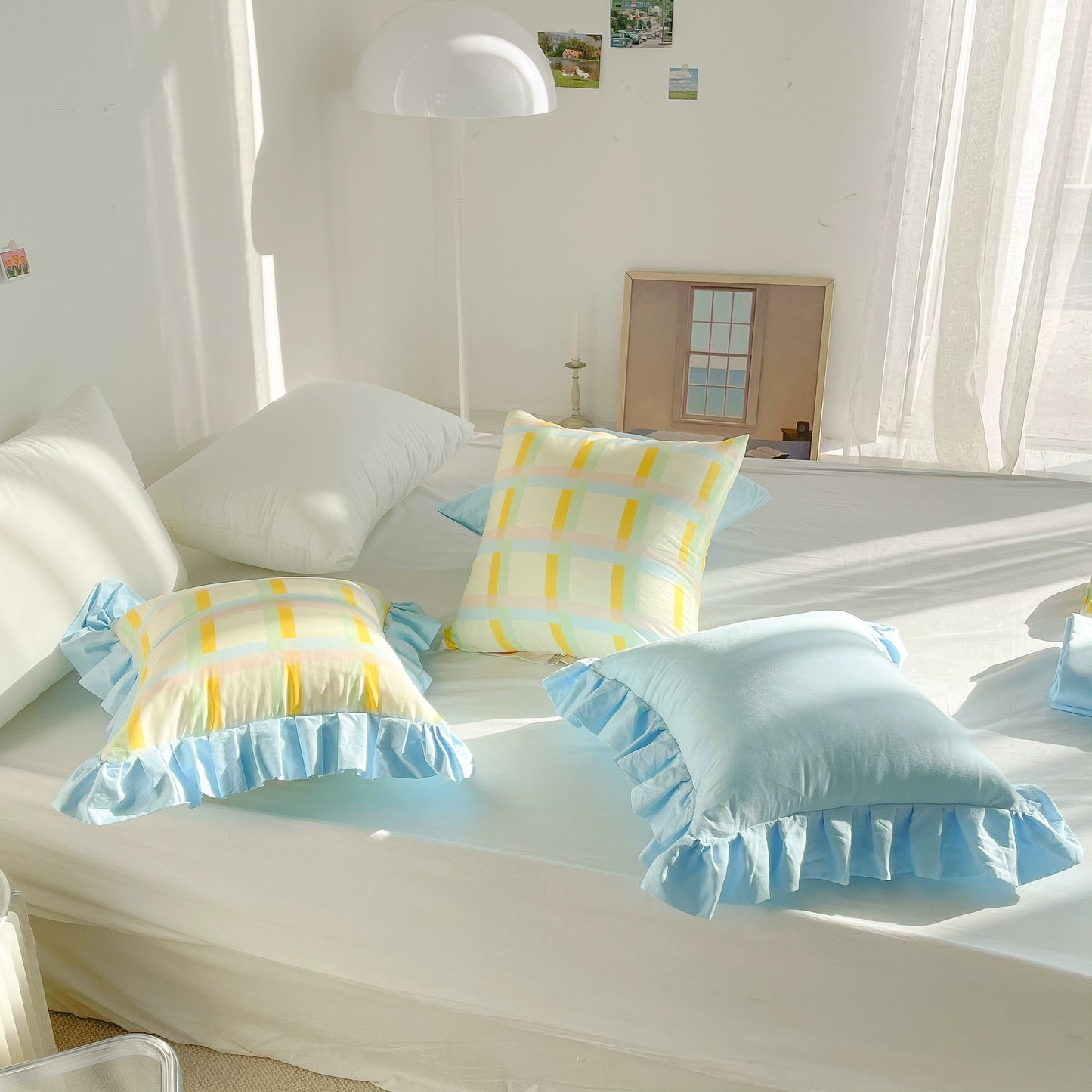 Vibrant cotton throw pillows with ruffle detail, available in solid or lattice prints