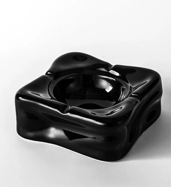 Foresta Ceramic Ashtray with cute ball detail, irregular shape, and modern design. Available in various colorways, choose between lidded or lidless options to suit your style. Crafted from high-quality ceramic for a sleek and contemporary smoking accessory.