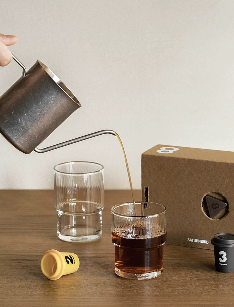 A set of Lyle Stackable Glasses, featuring sleek and minimalistic design. The glasses are crafted from high-quality, clear glass and are stackable for easy storage. Each glass holds 12 ounces, making them ideal for everyday use or entertaining. Perfect for home décor enthusiasts looking to add functional and stylish glassware to their kitchen or dining space.