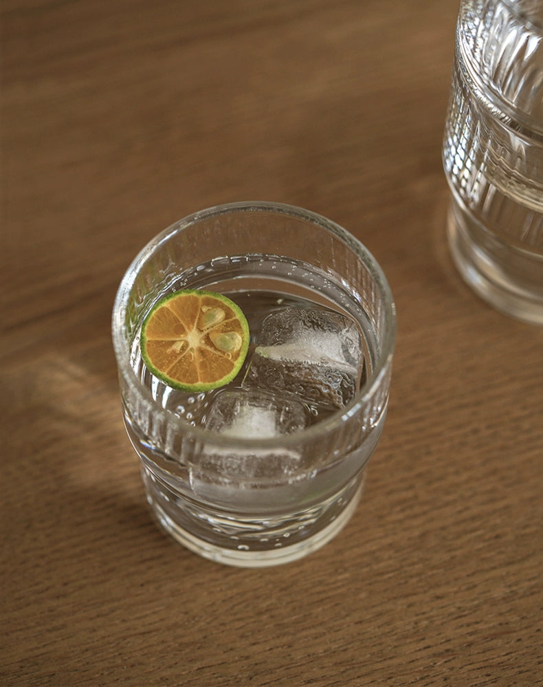 A set of Lyle Stackable Glasses, featuring sleek and minimalistic design. The glasses are crafted from high-quality, clear glass and are stackable for easy storage. Each glass holds 12 ounces, making them ideal for everyday use or entertaining. Perfect for home décor enthusiasts looking to add functional and stylish glassware to their kitchen or dining space.