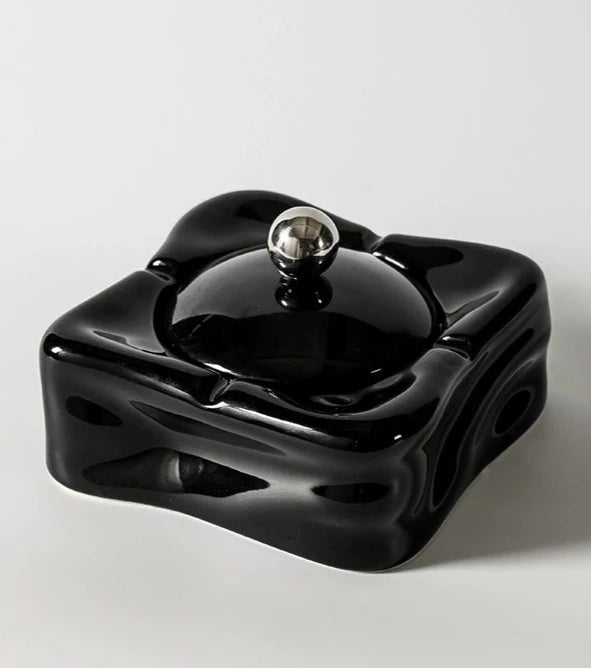 Foresta Ceramic Ashtray with cute ball detail, irregular shape, and modern design. Available in various colorways, choose between lidded or lidless options to suit your style. Crafted from high-quality ceramic for a sleek and contemporary smoking accessory.