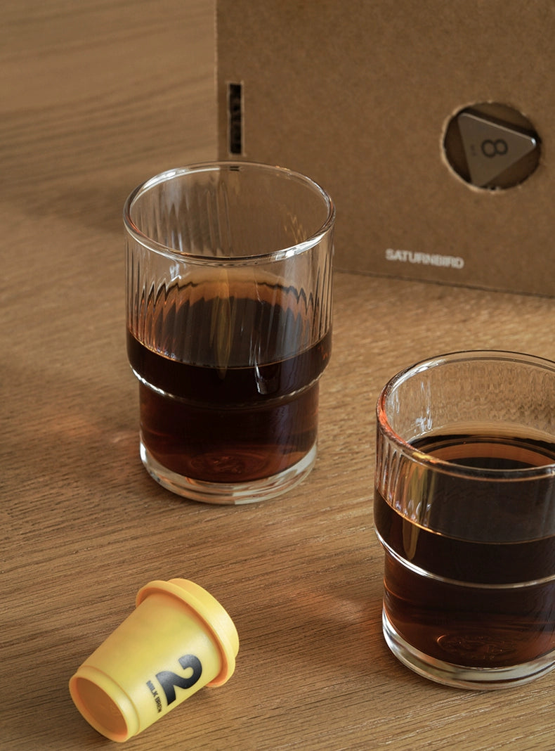A set of Lyle Stackable Glasses, featuring sleek and minimalistic design. The glasses are crafted from high-quality, clear glass and are stackable for easy storage. Each glass holds 12 ounces, making them ideal for everyday use or entertaining. Perfect for home décor enthusiasts looking to add functional and stylish glassware to their kitchen or dining space.