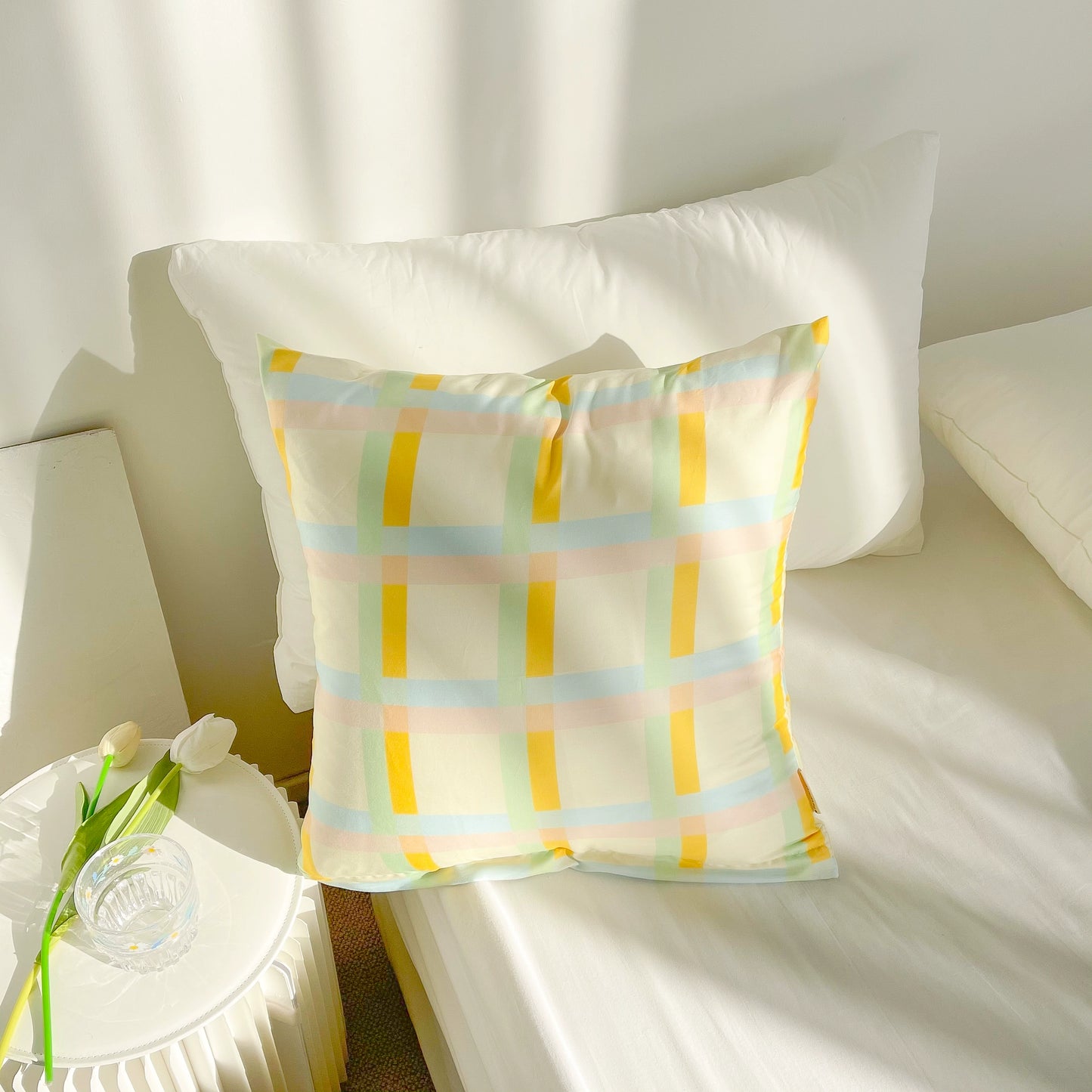 Vibrant cotton throw pillows with ruffle detail, available in solid or lattice prints