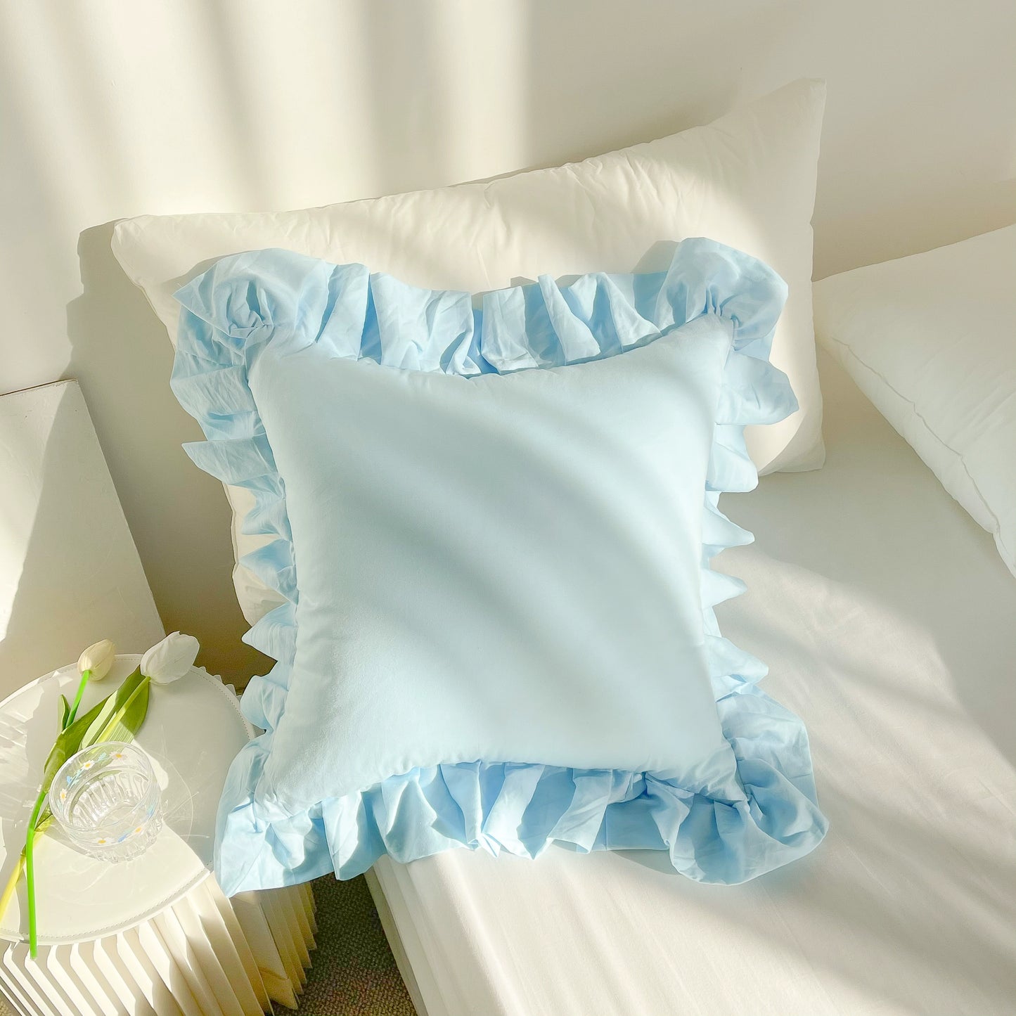 Vibrant cotton throw pillows with ruffle detail, available in solid or lattice prints