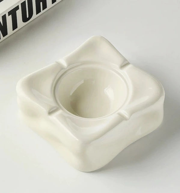 Foresta Ceramic Ashtray with cute ball detail, irregular shape, and modern design. Available in various colorways, choose between lidded or lidless options to suit your style. Crafted from high-quality ceramic for a sleek and contemporary smoking accessory.