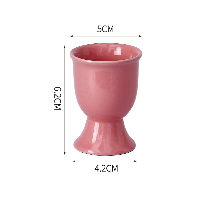 Stylish ceramic egg cup for drippy or hard-boiled eggs - vibrant colors, durable design. Perfect breakfast accessory.