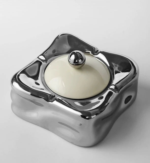 Foresta Ceramic Ashtray with cute ball detail, irregular shape, and modern design. Available in various colorways, choose between lidded or lidless options to suit your style. Crafted from high-quality ceramic for a sleek and contemporary smoking accessory.