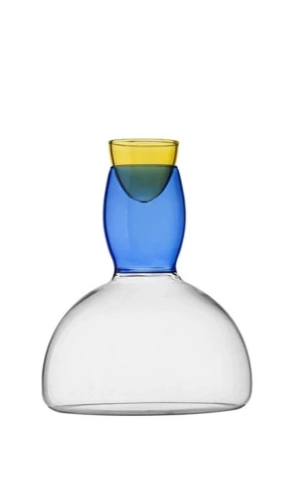 Jace Wine Glasses and Decanter image: A vibrant set of wine glasses in standard (260 ml) and large (420 ml) sizes, crafted from colored glass, accompanied by a stylish decanter with a 1500 ml capacity. The colorful glassware adds a lively touch to any table setting, perfect for both casual and formal occasions.