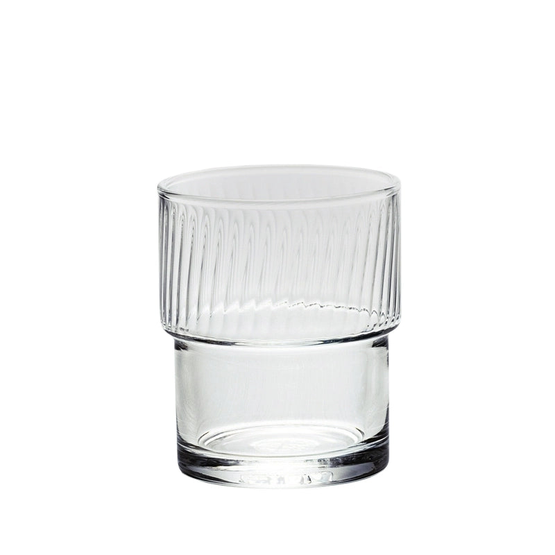 A set of Lyle Stackable Glasses, featuring sleek and minimalistic design. The glasses are crafted from high-quality, clear glass and are stackable for easy storage. Each glass holds 12 ounces, making them ideal for everyday use or entertaining. Perfect for home décor enthusiasts looking to add functional and stylish glassware to their kitchen or dining space.