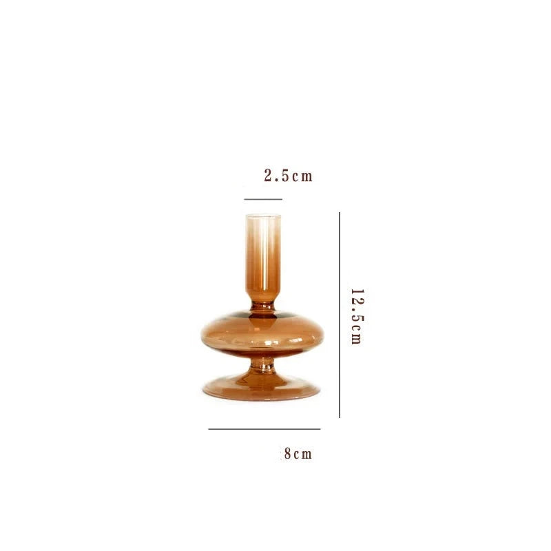 A brown glass Rhea Candle Holder set, featuring four different silhouettes in various sizes, creating a warm and inviting retro ambiance.