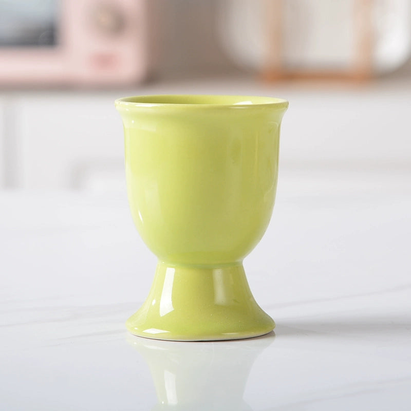 Stylish ceramic egg cup for drippy or hard-boiled eggs - vibrant colors, durable design. Perfect breakfast accessory.