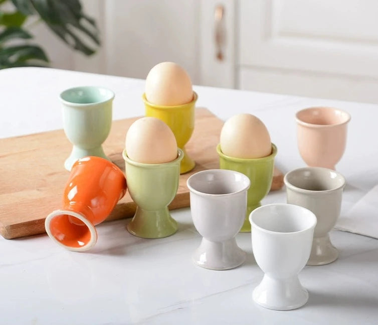 Stylish ceramic egg cup for drippy or hard-boiled eggs - vibrant colors, durable design. Perfect breakfast accessory.