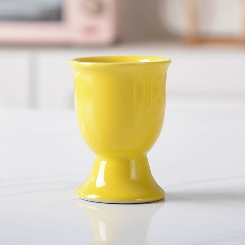 Stylish ceramic egg cup for drippy or hard-boiled eggs - vibrant colors, durable design. Perfect breakfast accessory.