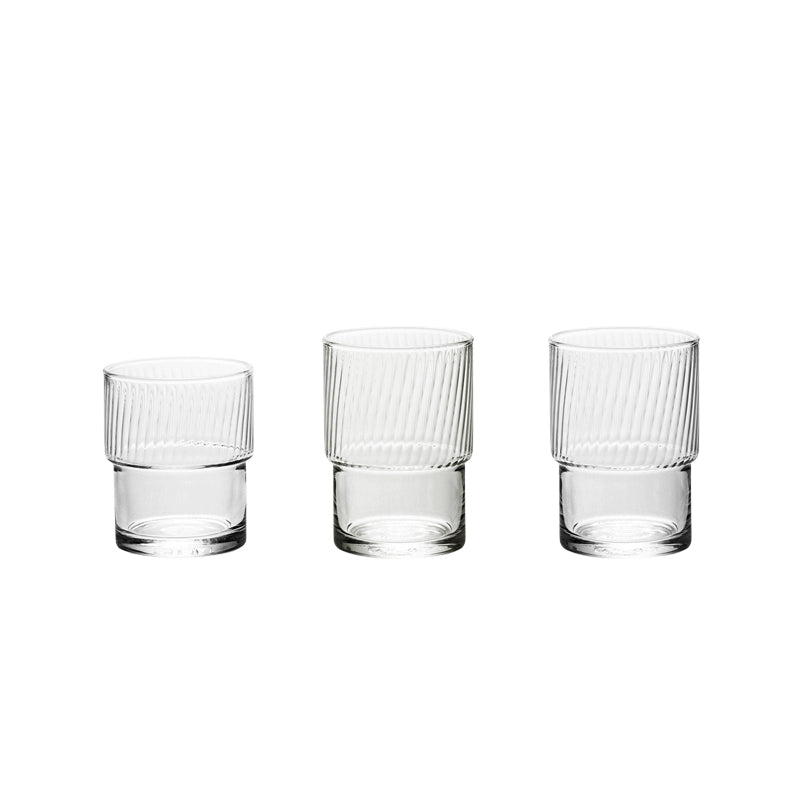A set of Lyle Stackable Glasses, featuring sleek and minimalistic design. The glasses are crafted from high-quality, clear glass and are stackable for easy storage. Each glass holds 12 ounces, making them ideal for everyday use or entertaining. Perfect for home décor enthusiasts looking to add functional and stylish glassware to their kitchen or dining space.