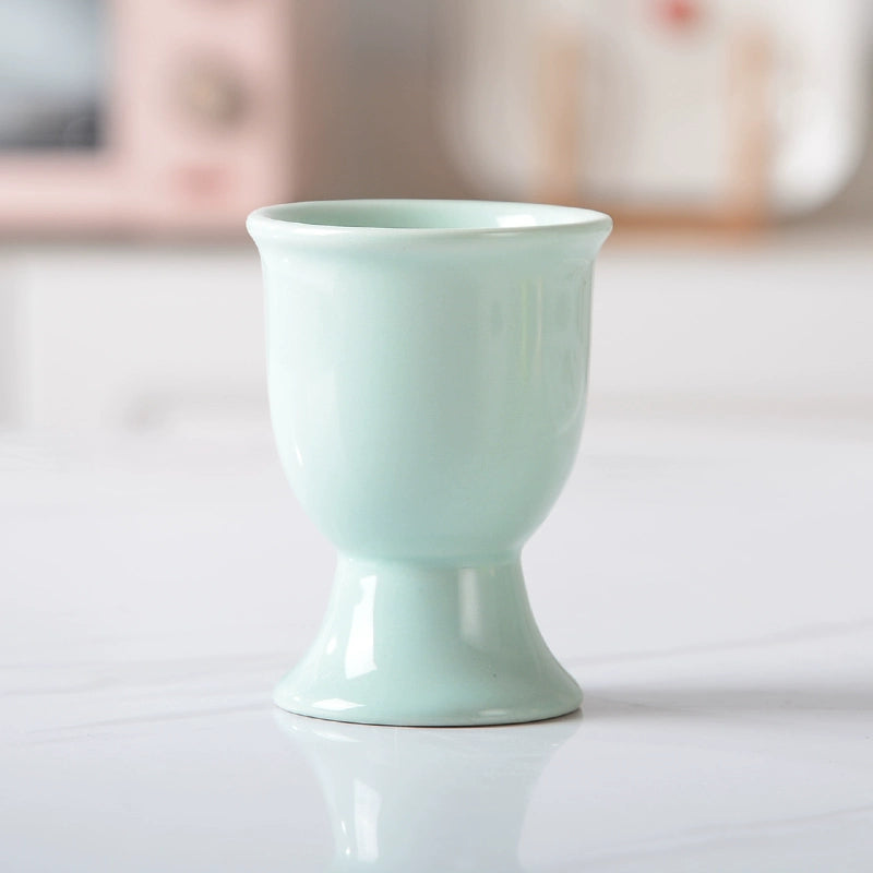Stylish ceramic egg cup for drippy or hard-boiled eggs - vibrant colors, durable design. Perfect breakfast accessory.