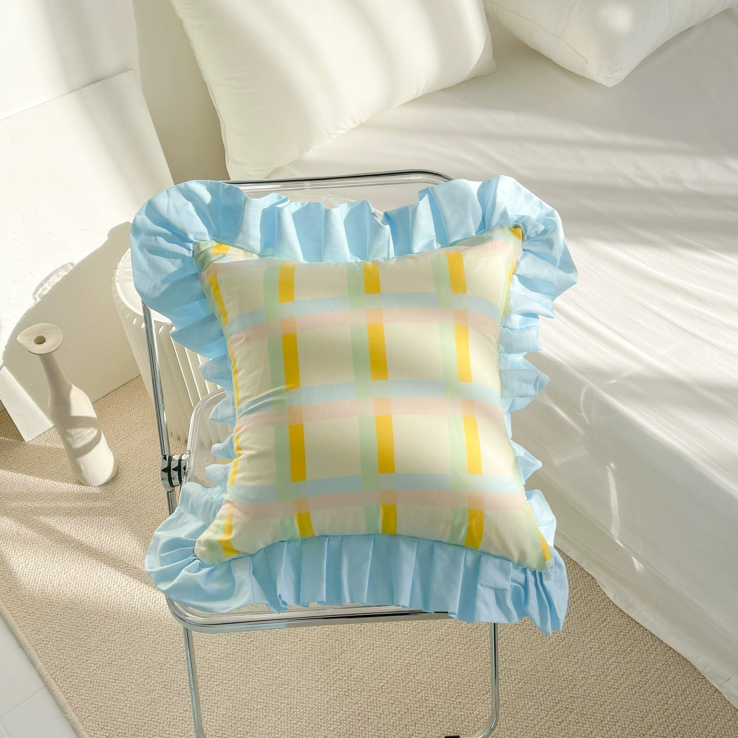 Vibrant cotton throw pillows with ruffle detail, available in solid or lattice prints