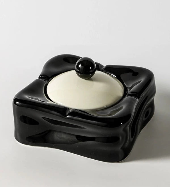 Foresta Ceramic Ashtray with cute ball detail, irregular shape, and modern design. Available in various colorways, choose between lidded or lidless options to suit your style. Crafted from high-quality ceramic for a sleek and contemporary smoking accessory.