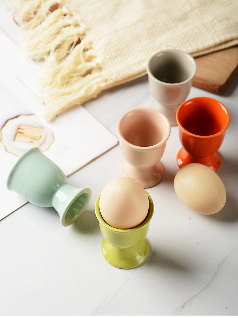 Stylish ceramic egg cup for drippy or hard-boiled eggs - vibrant colors, durable design. Perfect breakfast accessory.