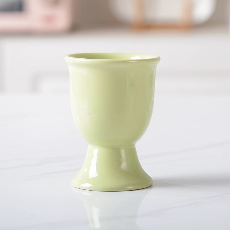 Stylish ceramic egg cup for drippy or hard-boiled eggs - vibrant colors, durable design. Perfect breakfast accessory.