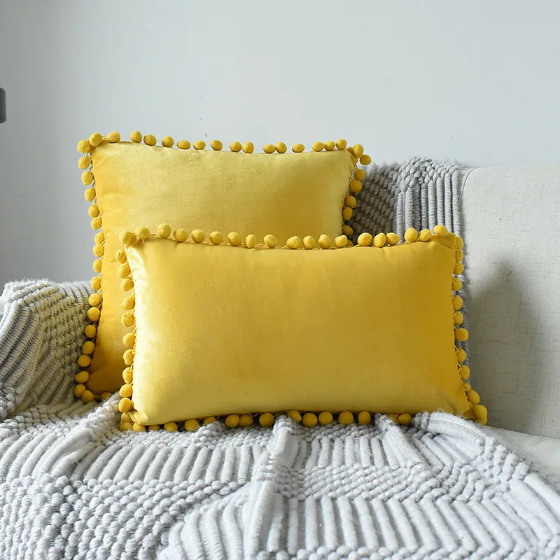 Yale Pillow Cover – luxurious velvet pillow cover with a small pom-pom border, available in multiple colors and sizes, adding a soft boho vibe to any room.