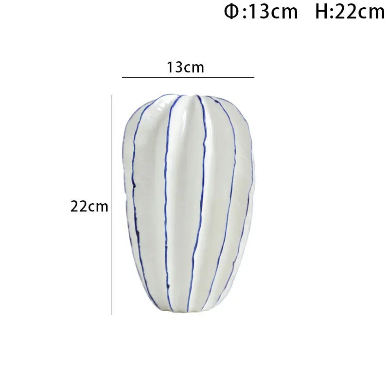 Summer Vase – elegant ceramic vase inspired by carambola fruit, featuring a white base with delicate blue detailing, available in small or large sizes.