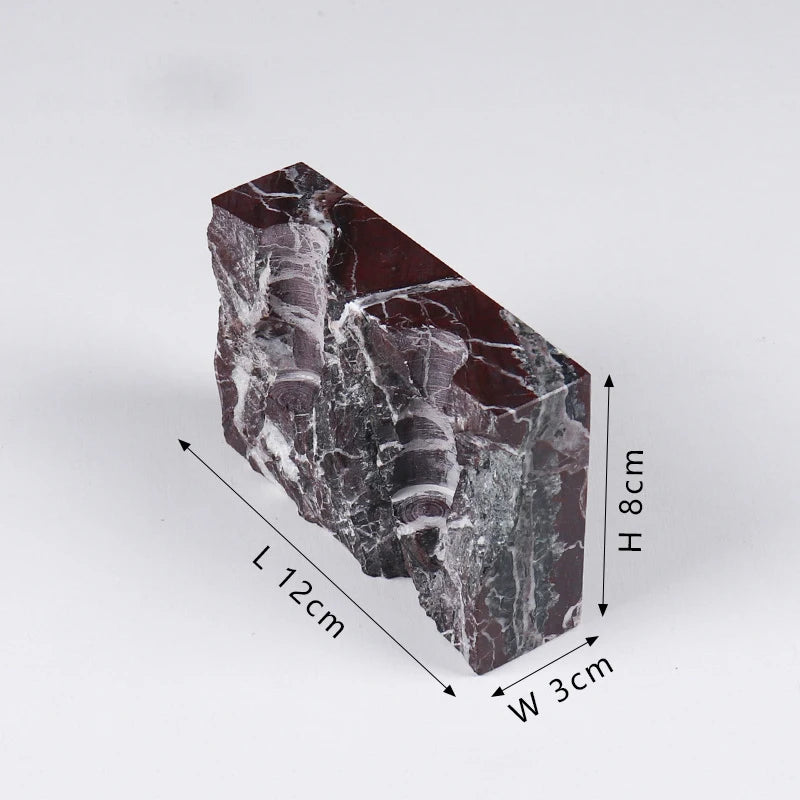 Brutalist candle holder with marble or travertine, anti-slip padding for stability.