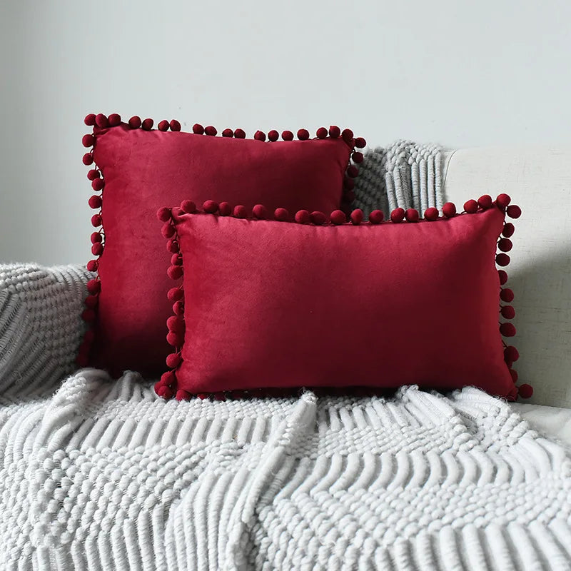 Yale Pillow Cover – luxurious velvet pillow cover with a small pom-pom border, available in multiple colors and sizes, adding a soft boho vibe to any room.
