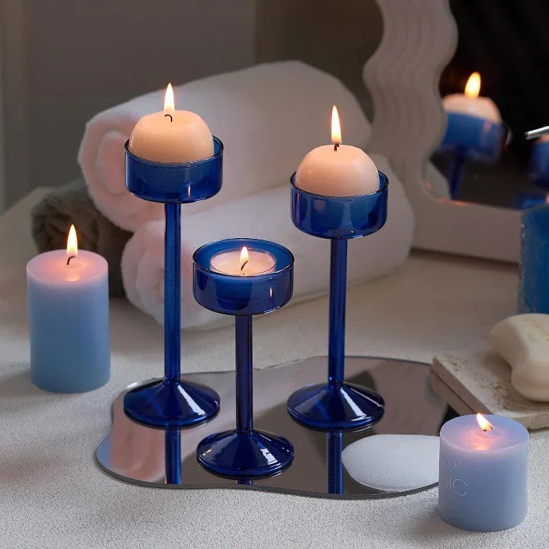 Kiu Candle Holder – set of three modern tea light holders in varying heights and colorways, perfect for creating a sleek, elegant centerpiece on tables, shelves, or mantels.
