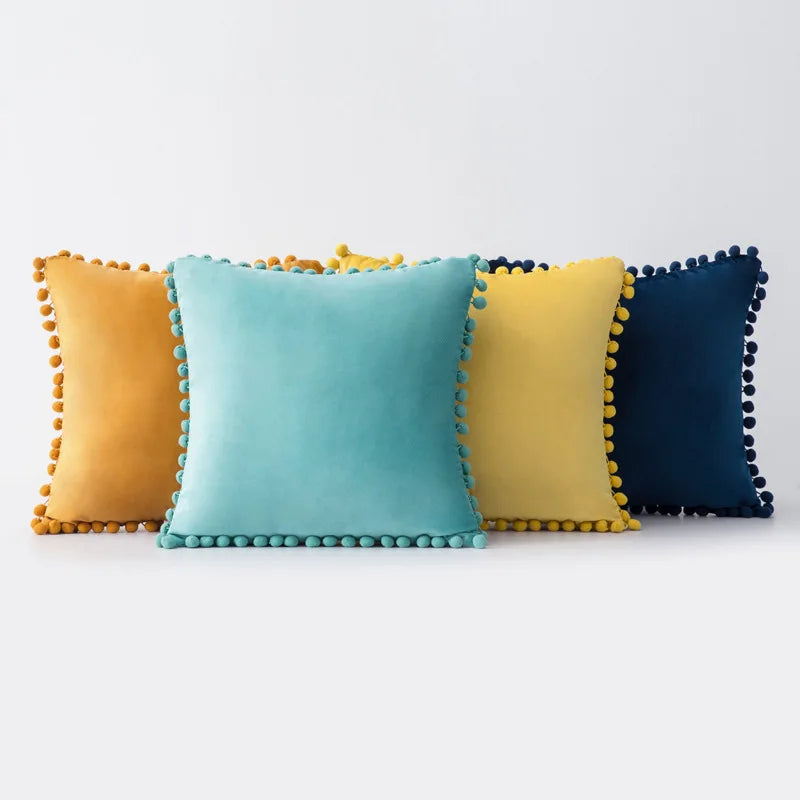 Yale Pillow Cover – luxurious velvet pillow cover with a small pom-pom border, available in multiple colors and sizes, adding a soft boho vibe to any room.