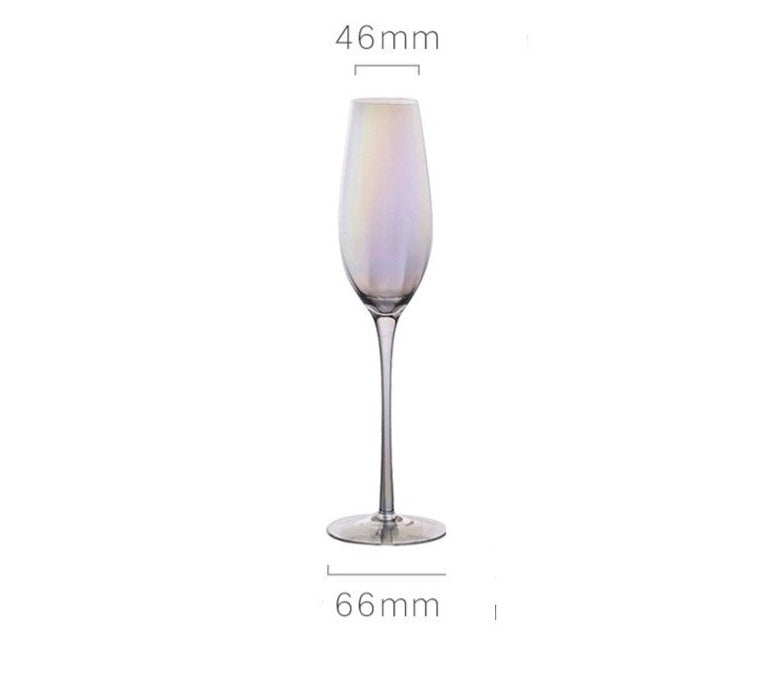 A collection of iridescent glassware from Domus Forge, featuring wine glasses, champagne coupes, decanters, and highball glasses in pastel gradient hues.
