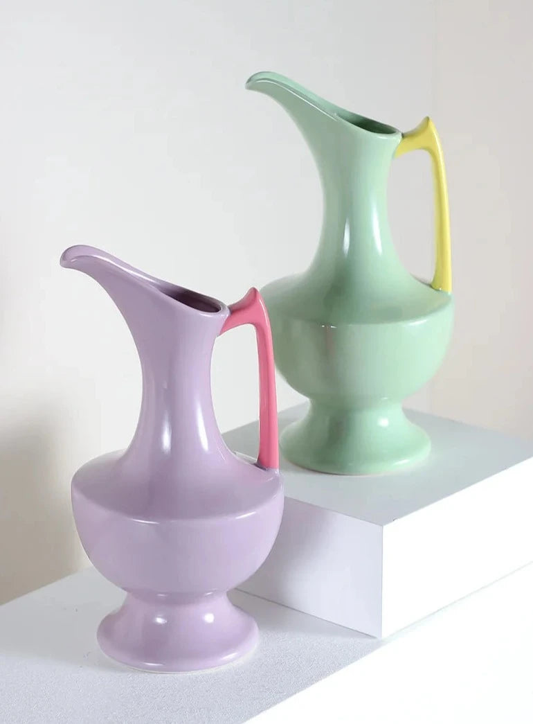 Colorful ceramic vase for floral display, bright décor accent.