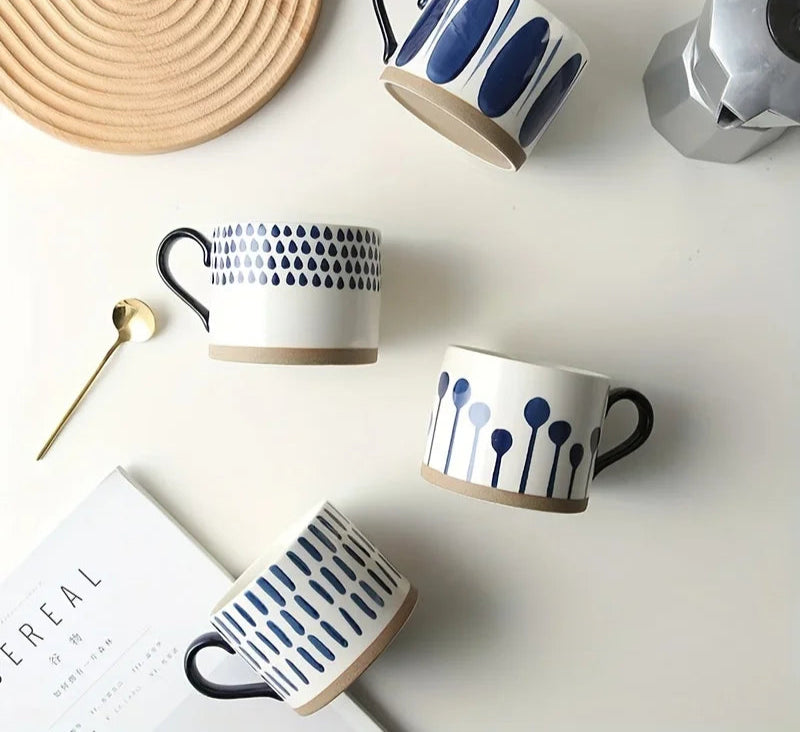 Vix Mug – 13oz cream ceramic mug with indigo-printed design, available in four unique styles, perfect for enjoying coffee, tea, or as a decorative piece.
