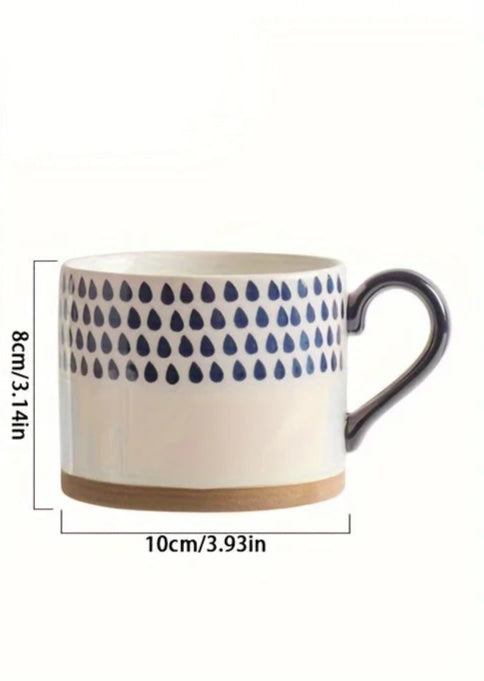 Vix Mug – 13oz cream ceramic mug with indigo-printed design, available in four unique styles, perfect for enjoying coffee, tea, or as a decorative piece.