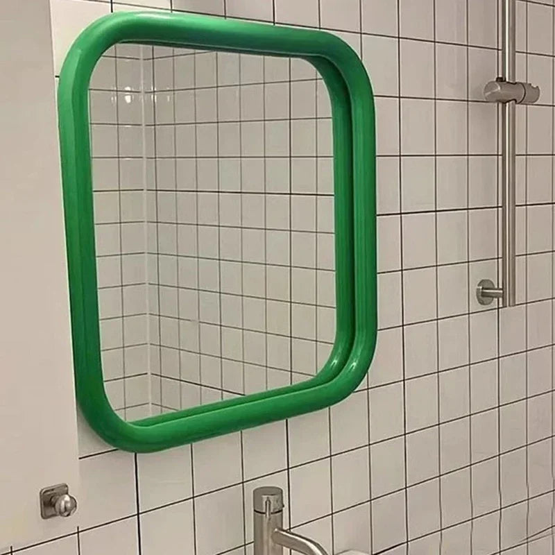 Uri Mirror – square mirror with rounded corners, vibrant colorways, and a retro-inspired design, available in small (60x60 cm) and large (80x80 cm) sizes.