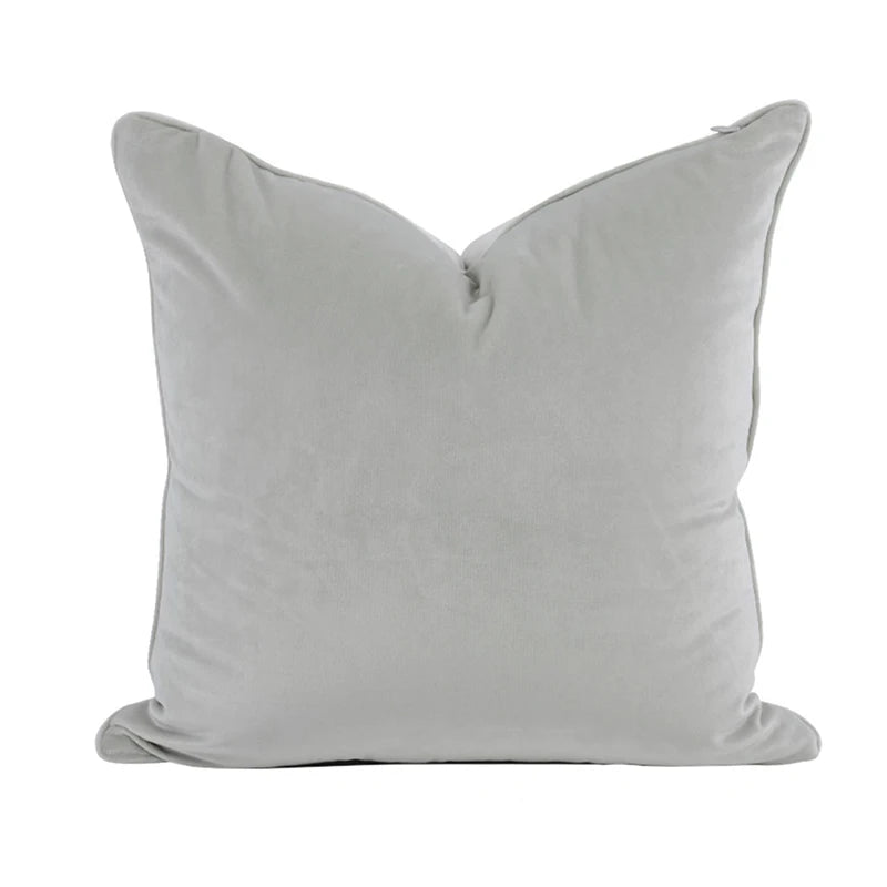 A collection of Bernadette Pillow Covers in various sizes and deep jewel tones, each crafted with a luxurious velvet feel. Made from 100% polyester, these pillow covers offer a rich and sophisticated look, perfect for home décor enthusiasts. Displayed on a sofa, the covers showcase their vibrant colorways and soft texture, ideal for adding elegance and comfort to any room. Pillow inserts are not included, allowing for customizable use and styling.